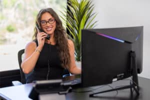 Front desk staff answering phone at Lewis Park Post Acute