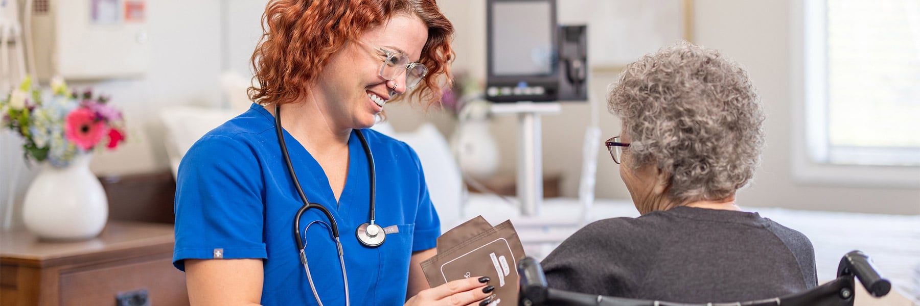 nurse taking patient's blood pressure at Lewis Park Post Acute