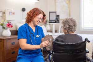 Nurse taking patient's blood pressure at Lewis Park Post Acute